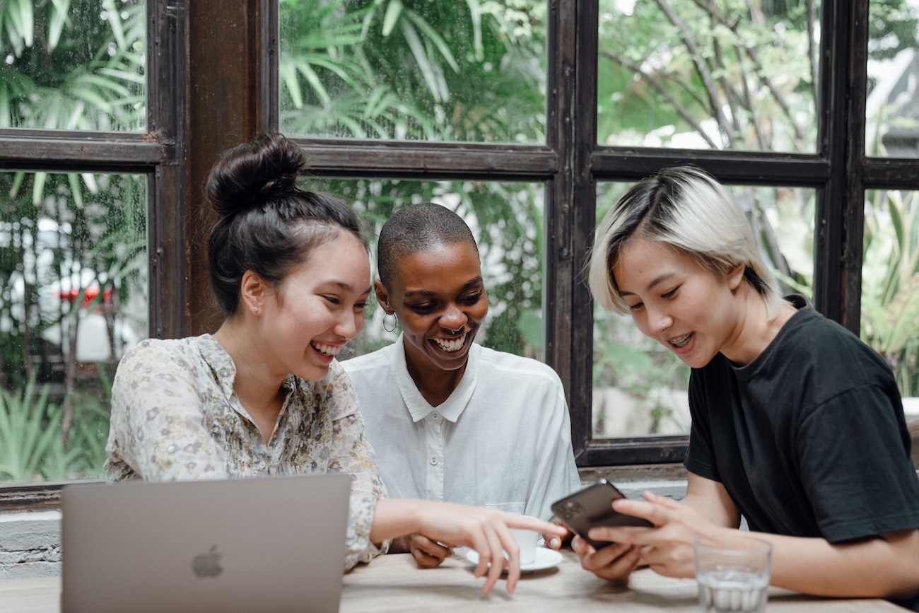 employees looking at phone