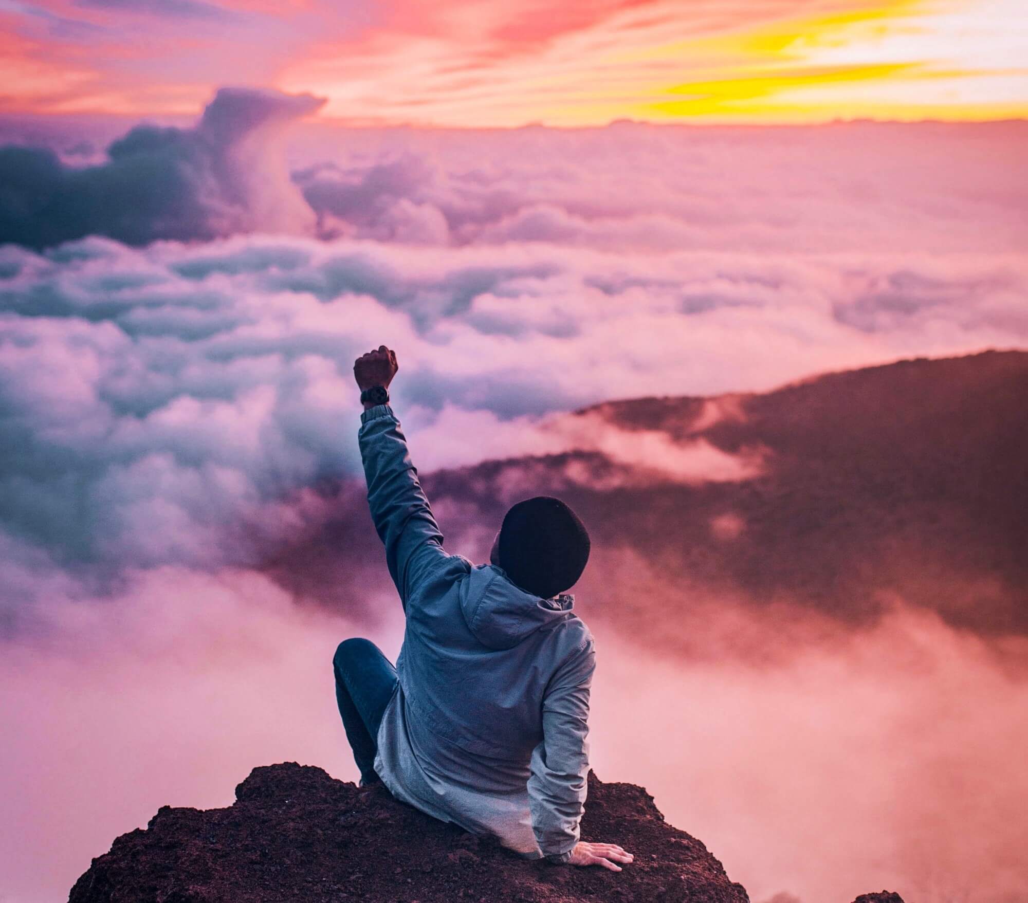 Man on Mountaintop experiencing Best-Self Management