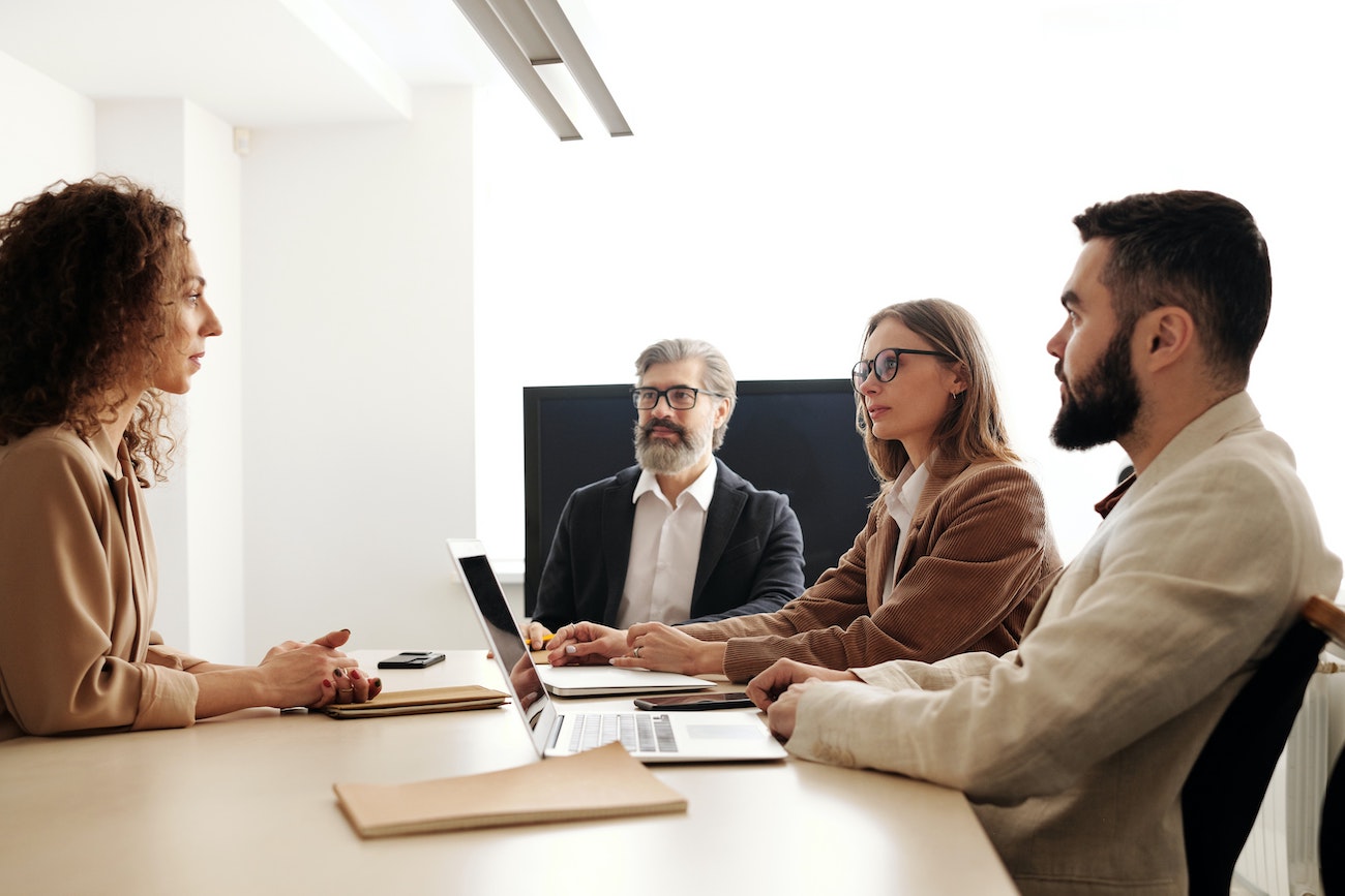 employees talking at table