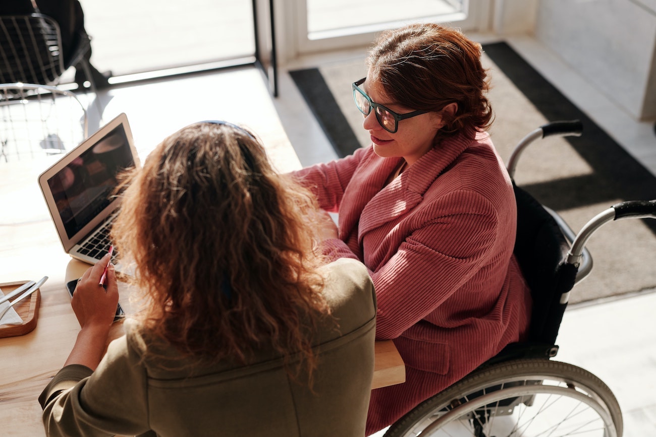 employees working together at laptop