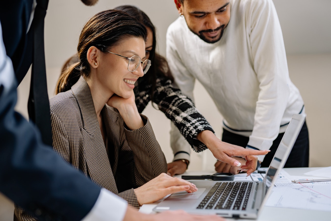 employee smiling at laptop